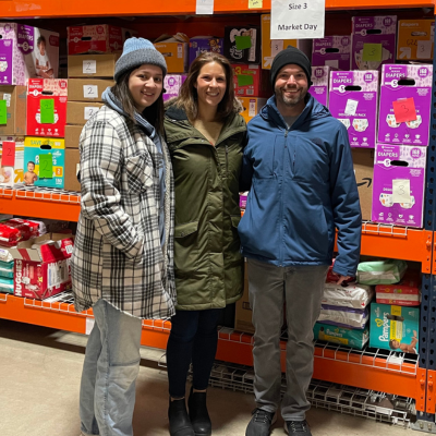 Three members of the Scan IM team volunteering at The Grace Upon Grace Project's Distribution Day.